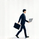 Icon representing a busy professional, perhaps a person with a briefcase and a laptop.